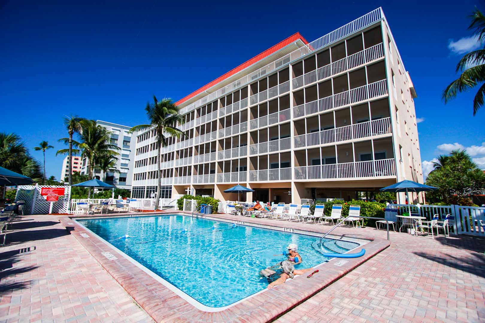 A crisp outdoor swimming pool at VRI's Windward Passage Resort in Fort Myers Beach, Florida.